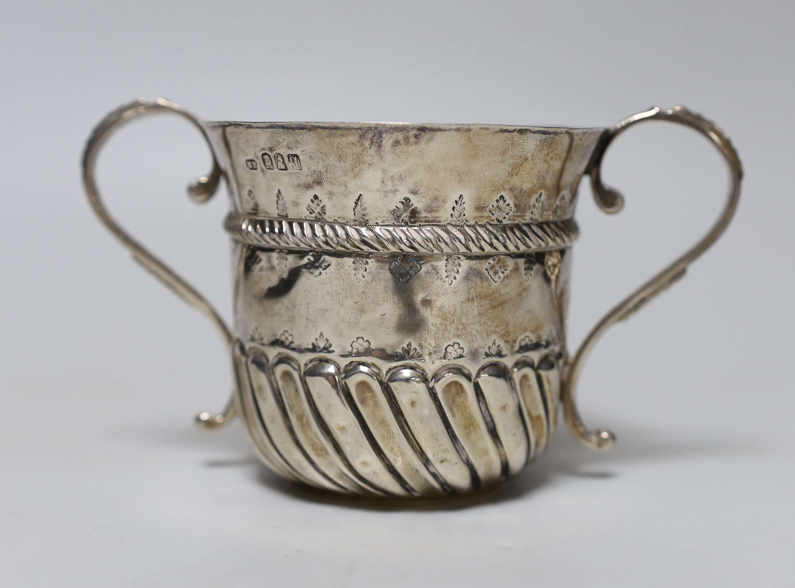 A George V 17th/18th century style Brittania standard silver porringer, Harry Freeman, London, 1911, height, 89mm, 6.1oz.